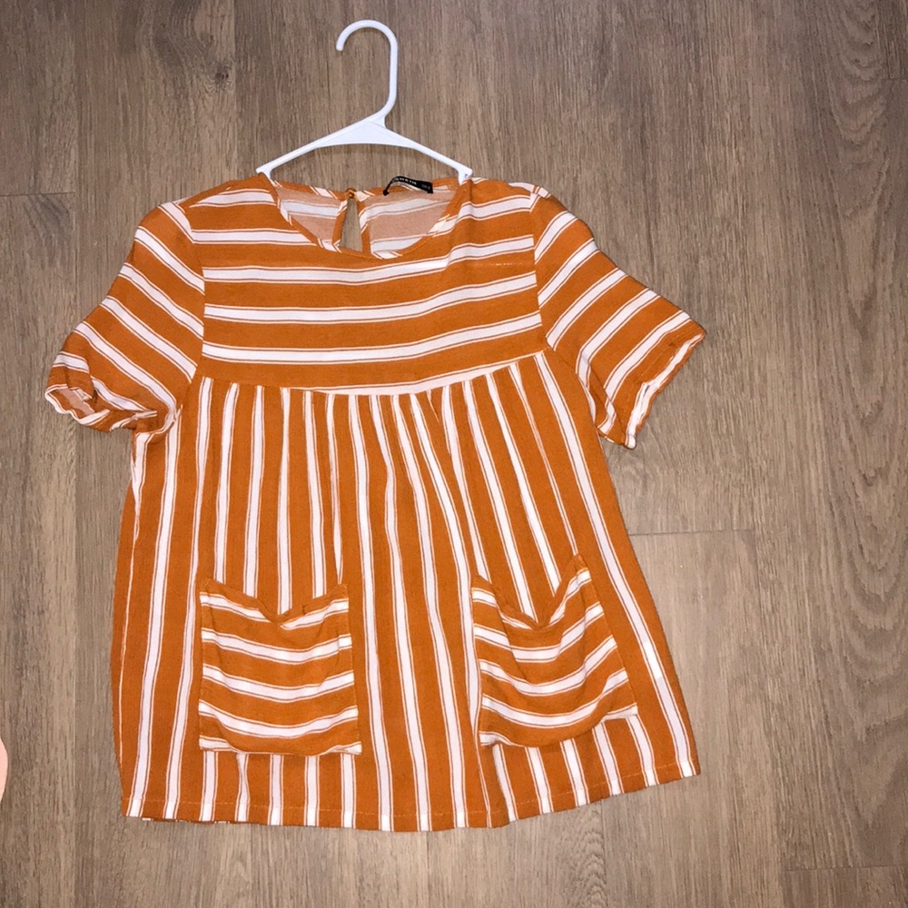 Orange and white striped blouse with pockets